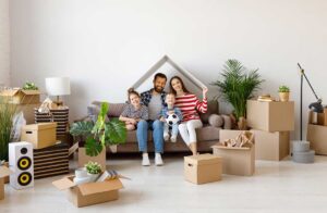 Family organizes moving boxes and household documents inside a newly occupied home.